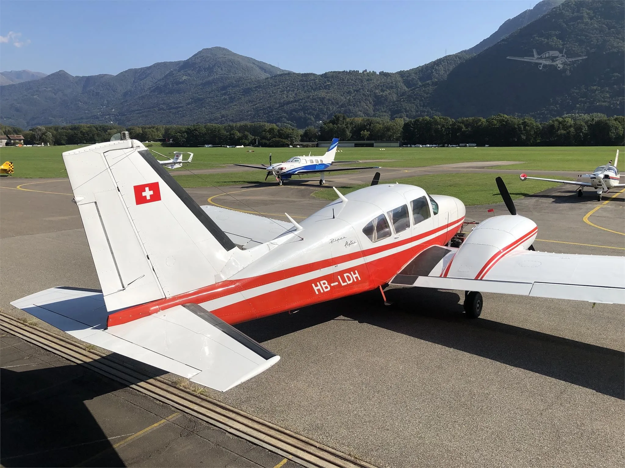 Exterior view of a 1966 PIPER TURBO AZTEC, HB-LDH.