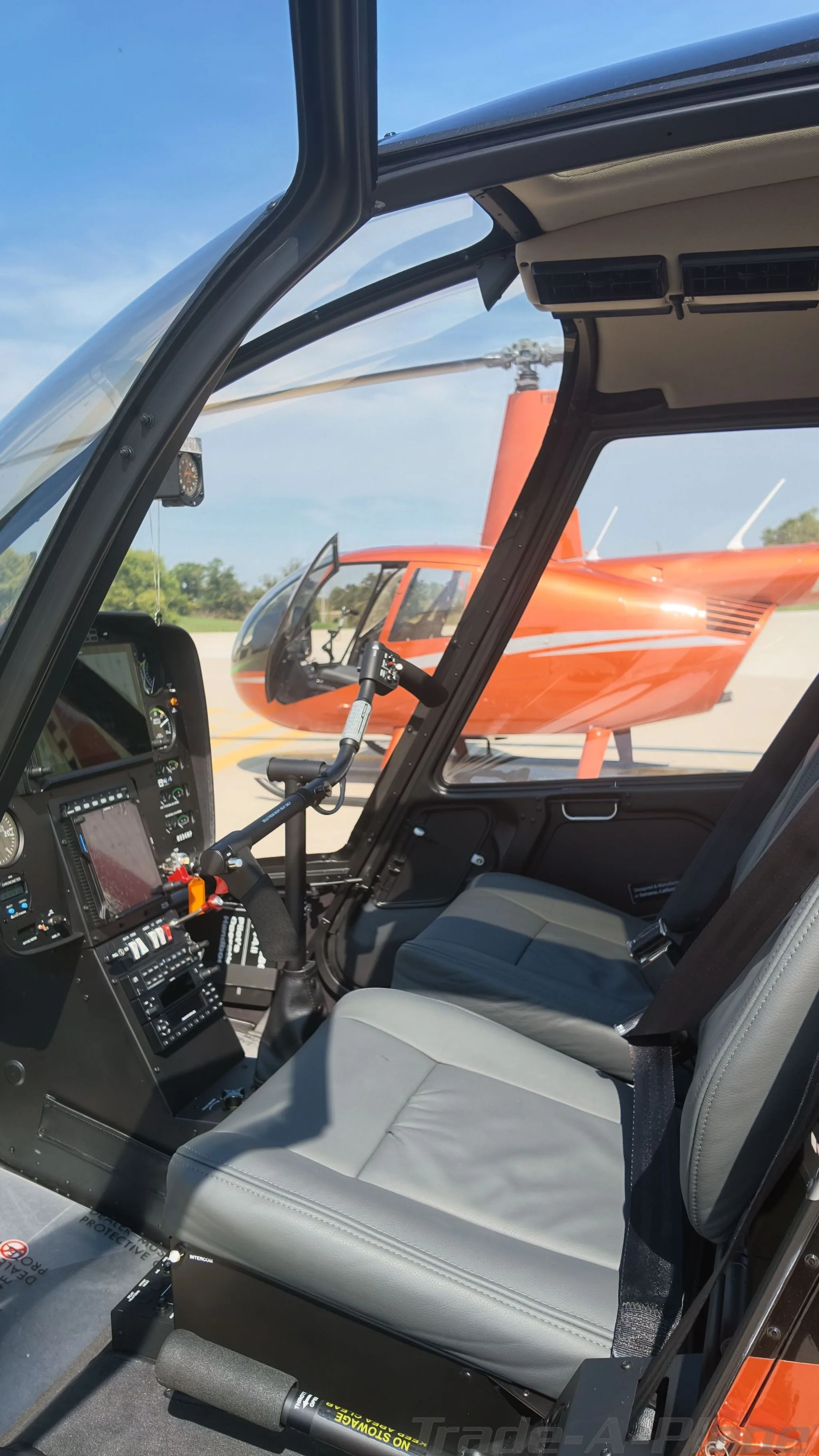 Cockpit and instrument panel of a 2025 ROBINSON R44 RAVEN II.