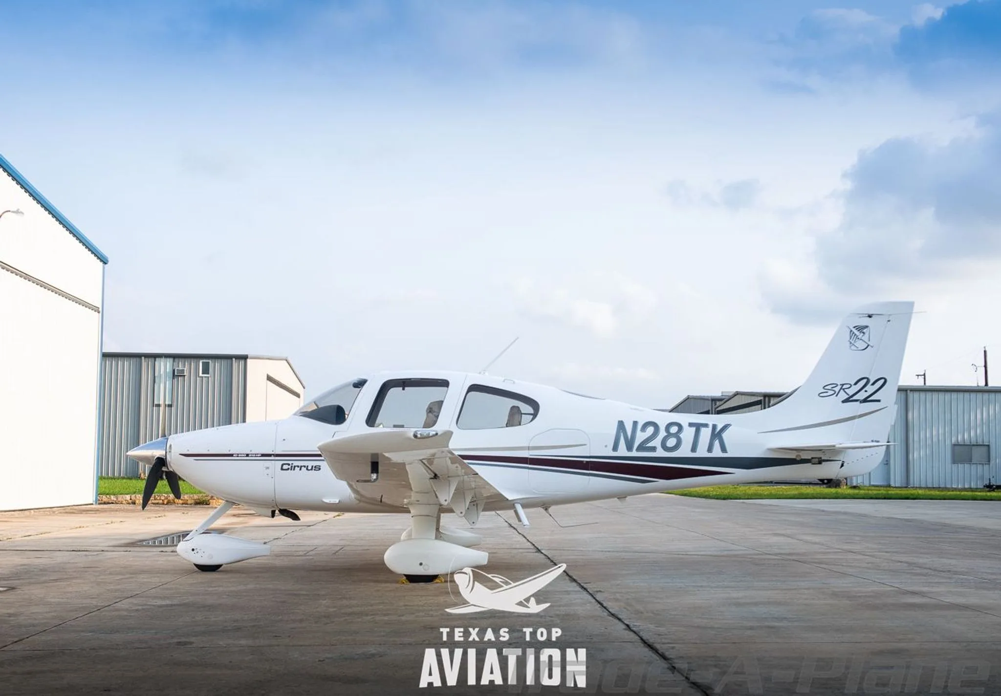 Exterior view of a 2002 CIRRUS SR22, N28TK.