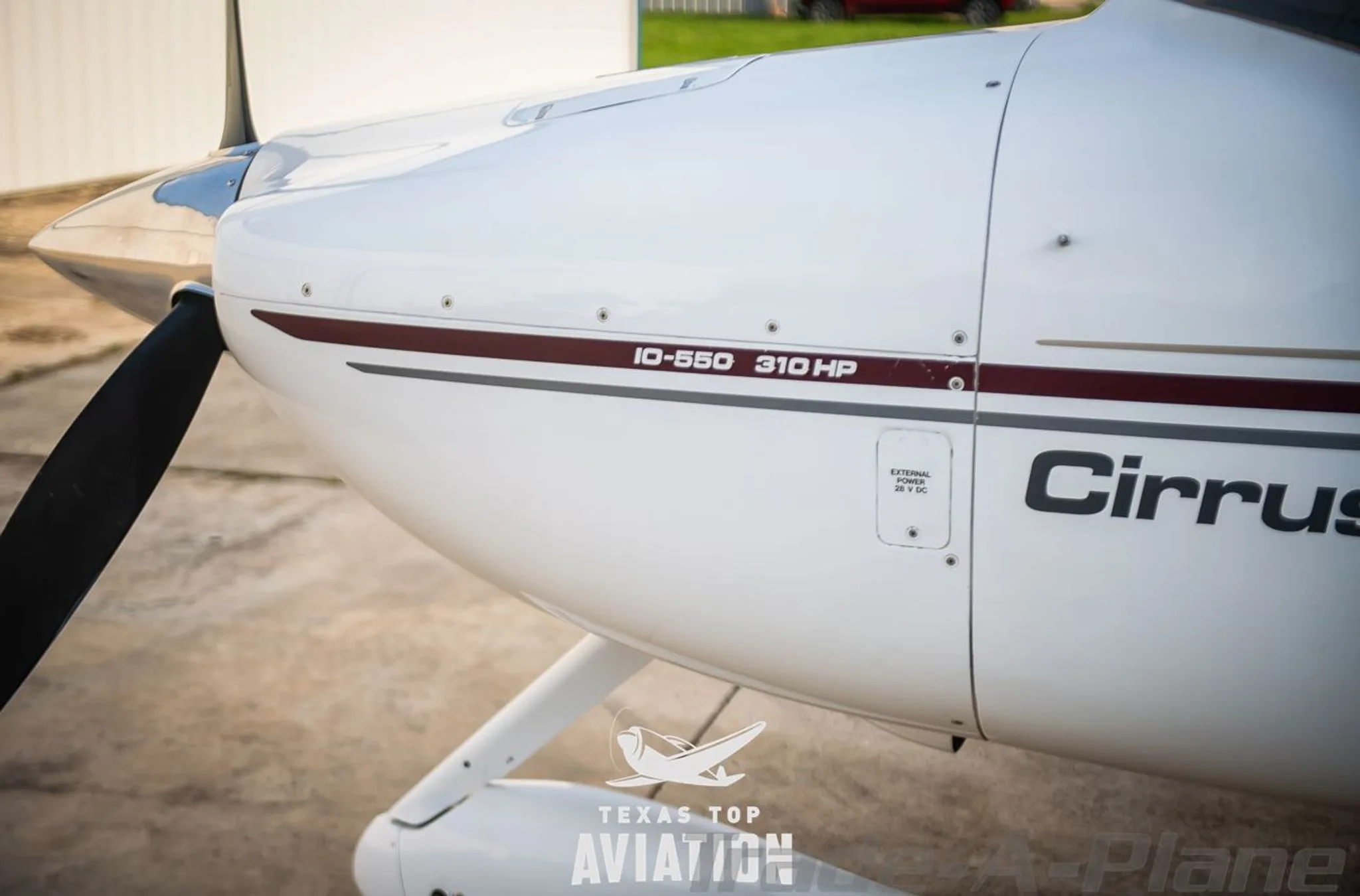 Exterior view of a 2002 CIRRUS SR22, N28TK.