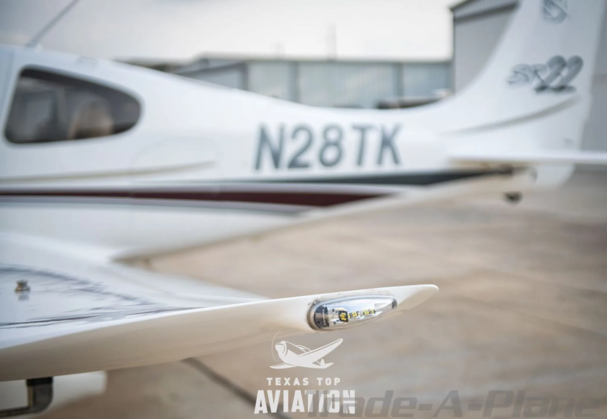 Exterior view of a 2002 CIRRUS SR22, N28TK.