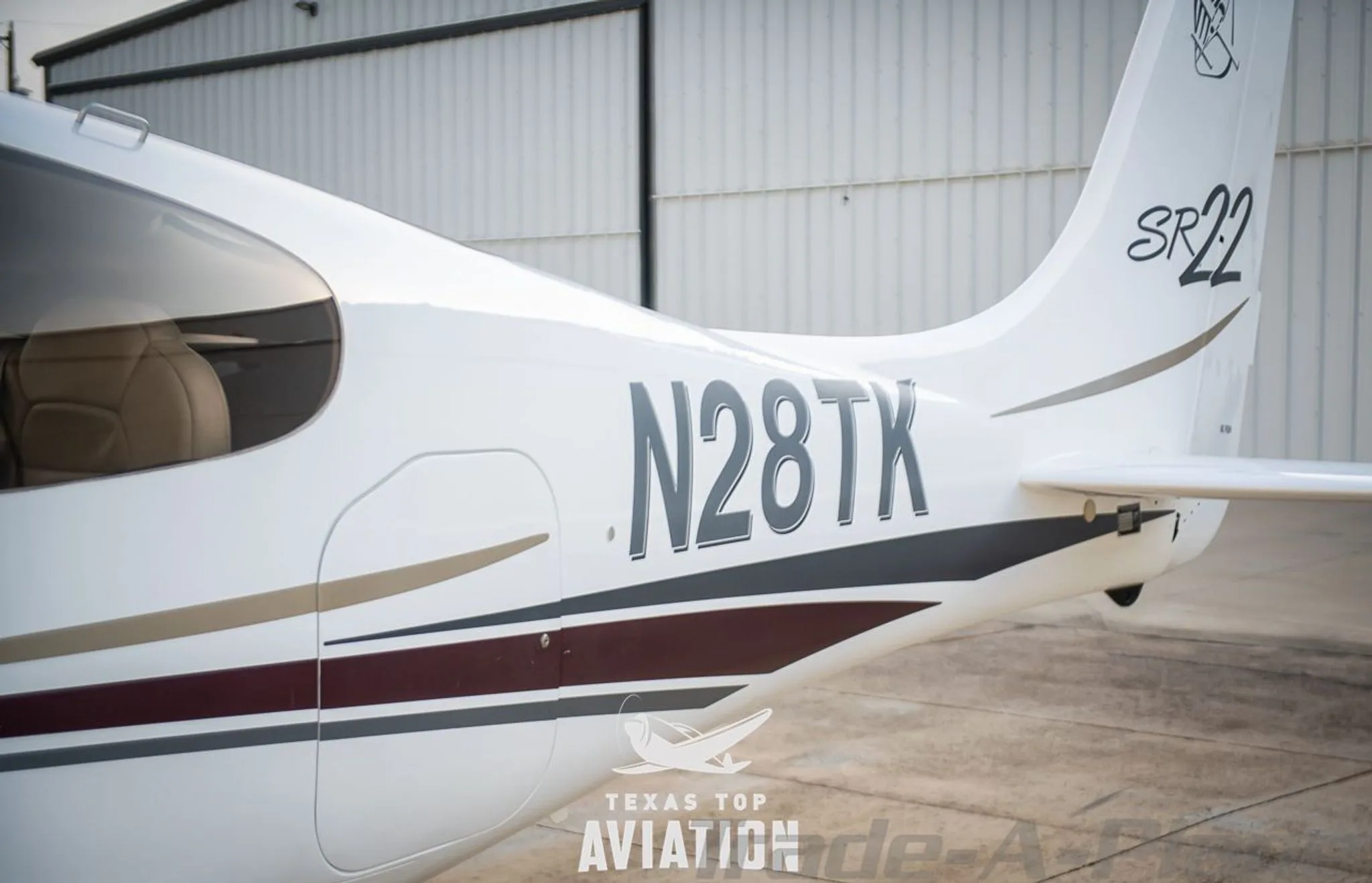 Exterior view of a 2002 CIRRUS SR22, N28TK.