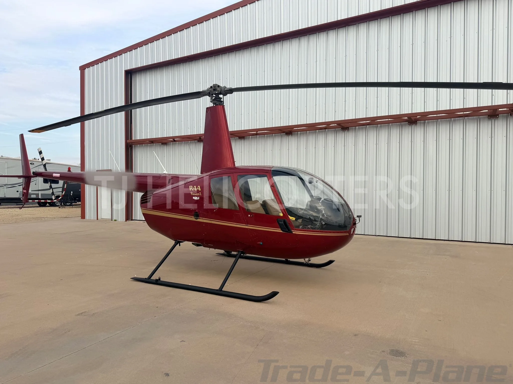 Exterior view of a 2004 ROBINSON R44 RAVEN I.