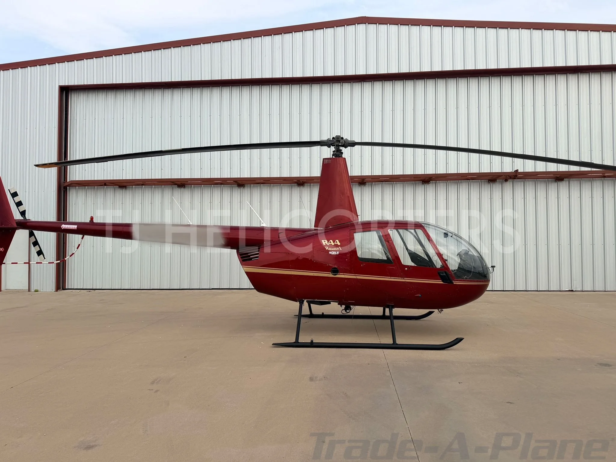 Exterior view of a 2004 ROBINSON R44 RAVEN I.