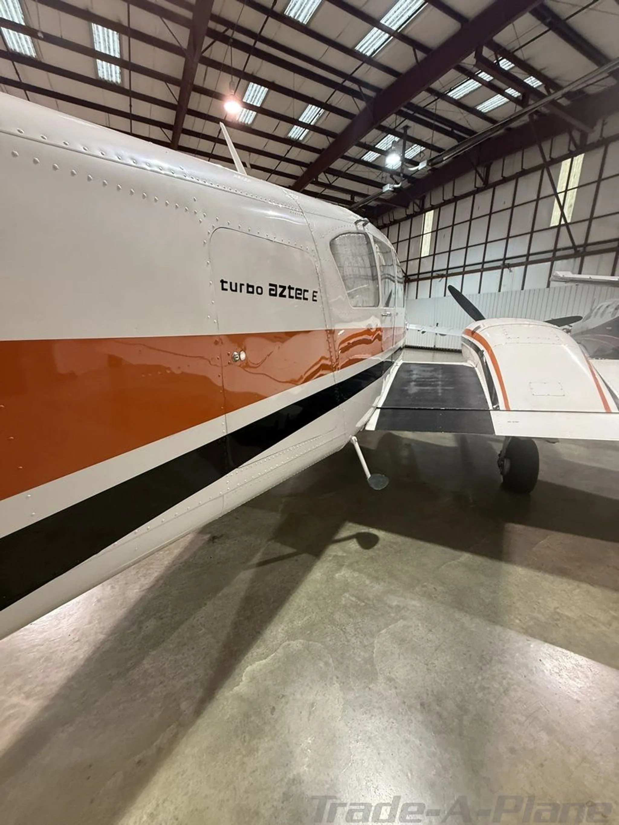 Exterior view of a 1975 PIPER TURBO AZTEC E, N713EC.