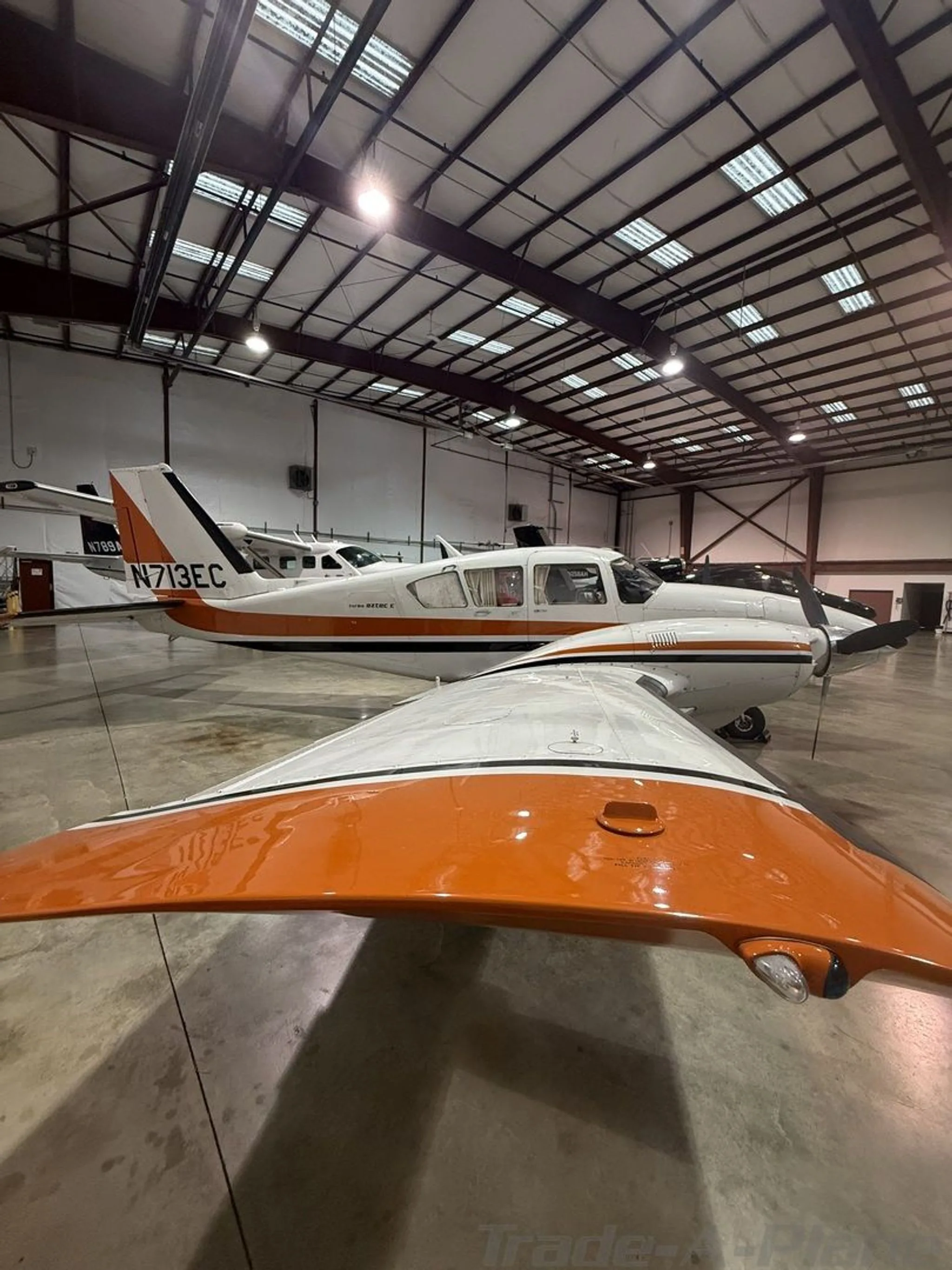 Exterior view of a 1975 PIPER TURBO AZTEC E, N713EC.