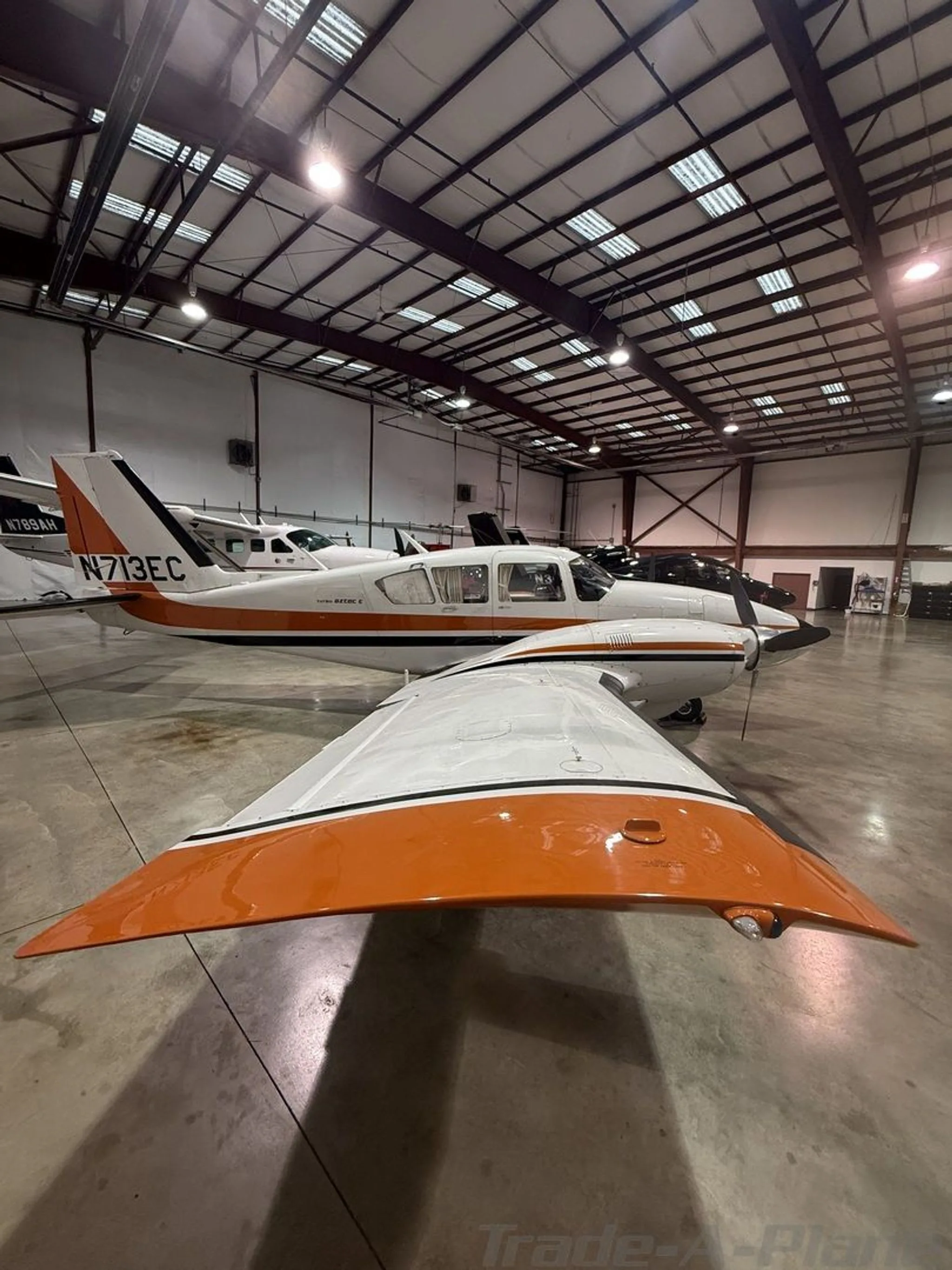 Exterior view of a 1975 PIPER TURBO AZTEC E, N713EC.
