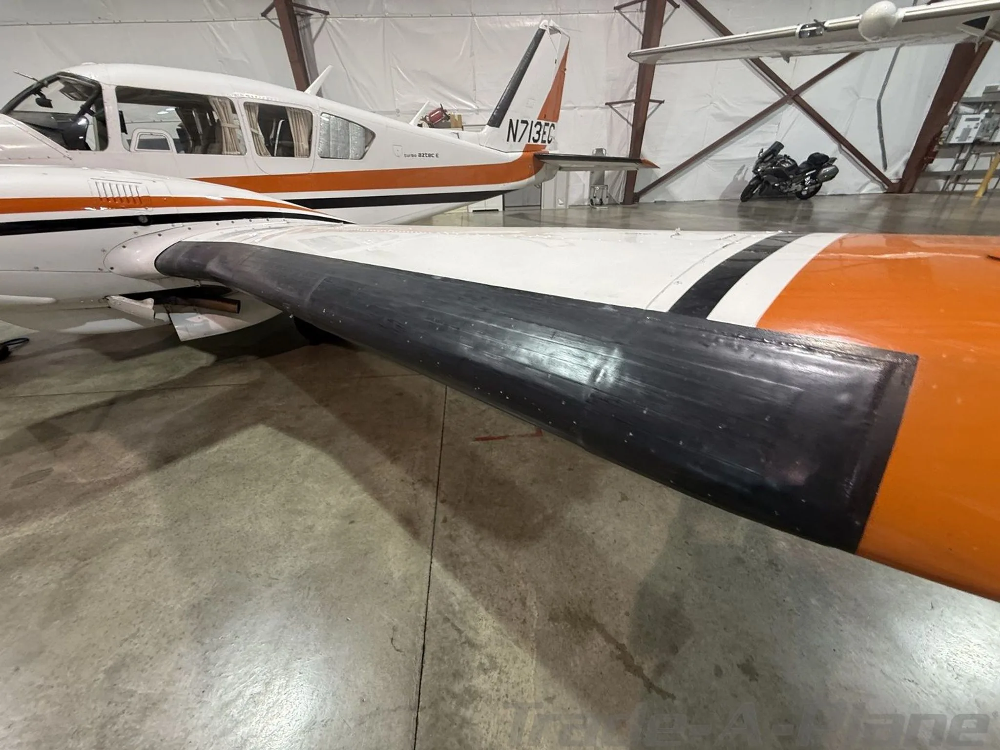 Exterior view of a 1975 PIPER TURBO AZTEC E, N713EC.